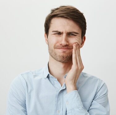 Boy with severe teeth pain.