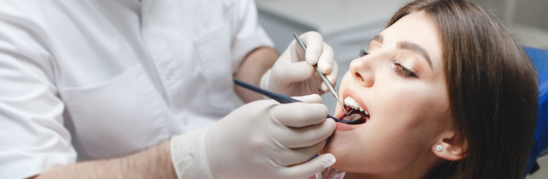 Dentist performing a dental procedure in a clinic.