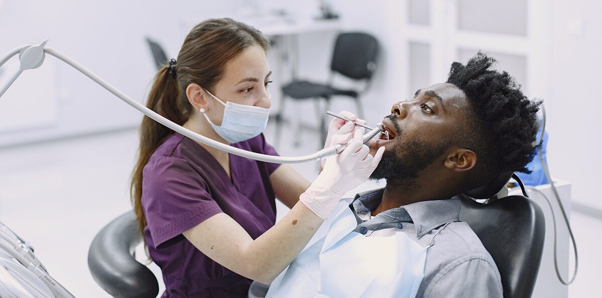 Dental hygienist performing a routine check-up
