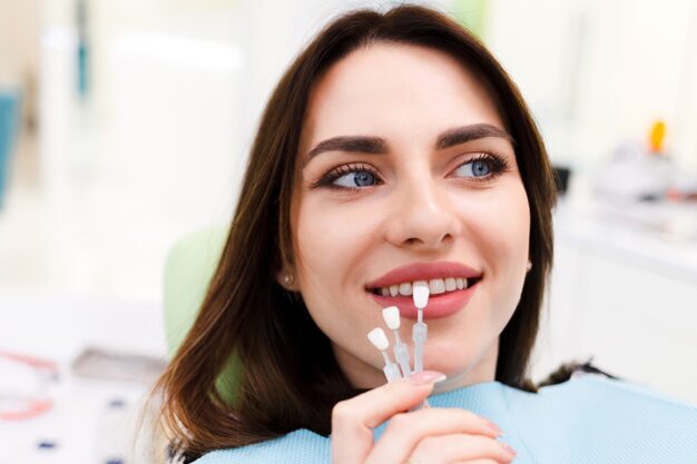 Girl getting dental veneers in dental clinic