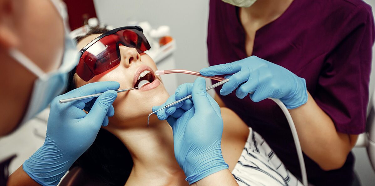 Dentist performing a dental procedure on a patient