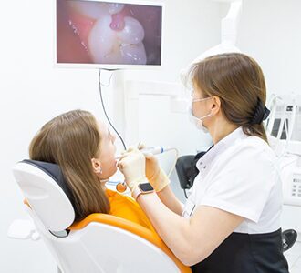 Dentist performing a dental procedure on a patient