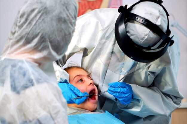 Dentist performing a dental procedure on a patient