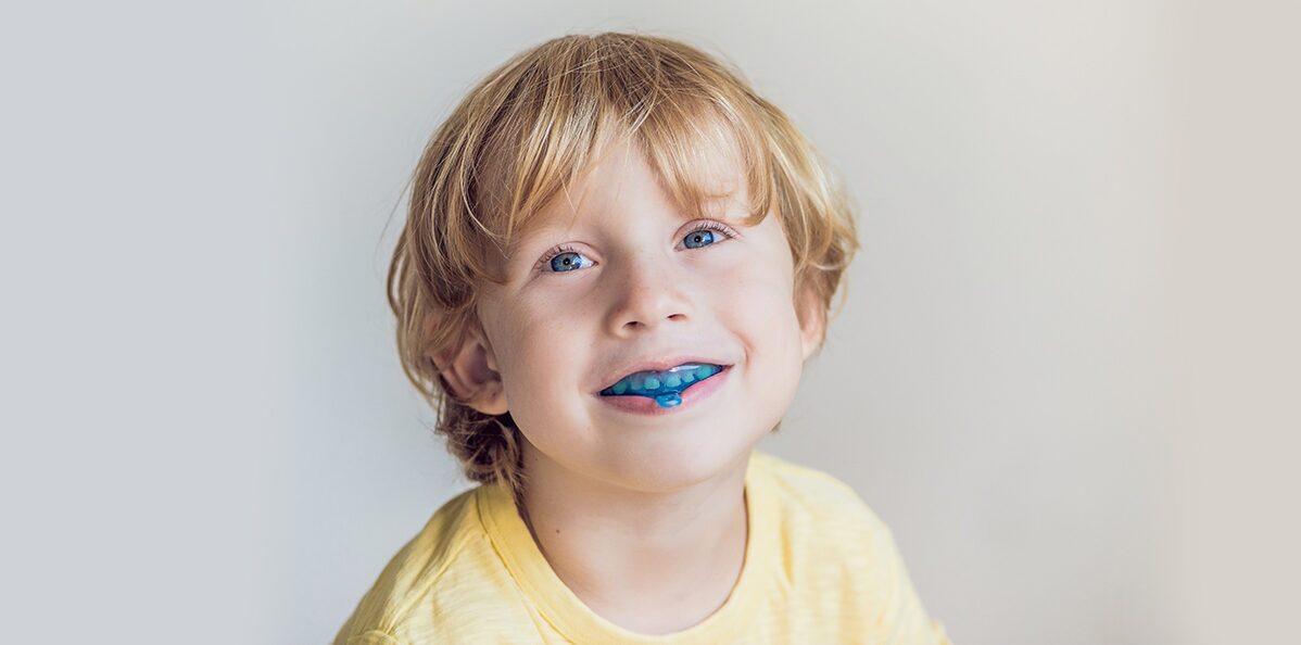 Little boy wearing mouthguard