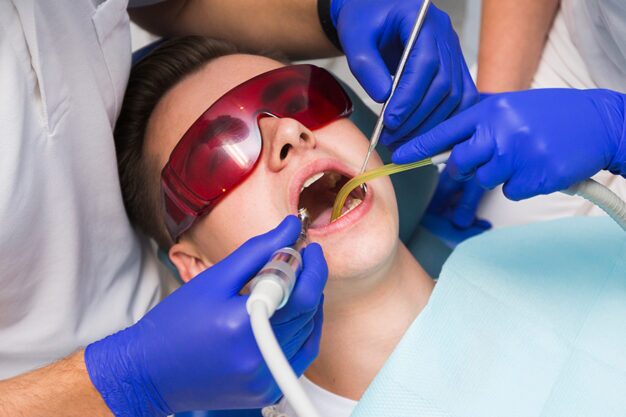 Dentist performing a procedure on a patient