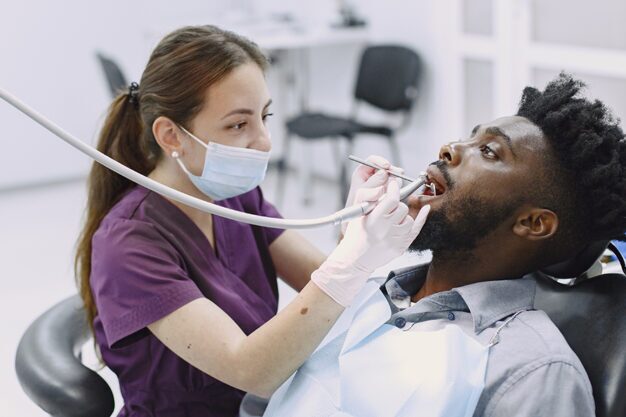 Dental hygienist performing a routine check-up