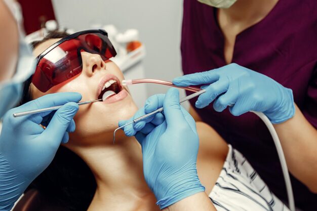 Dentist performing a dental procedure on a patient