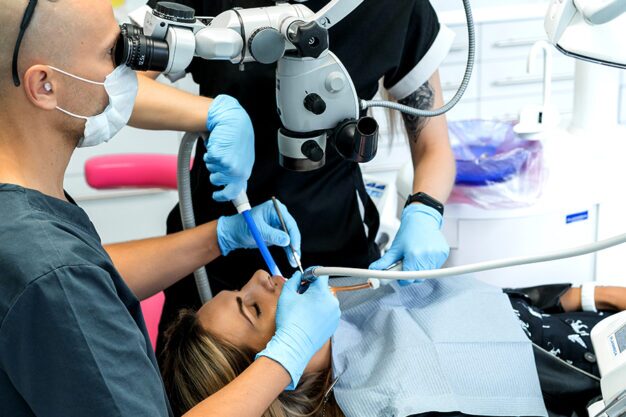 dentist doing procedure using dental scanner